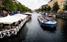Copenhagen: On a sunny day one of the best things to do in Copenhagen is to take a canal boat around the canals of Copenhagen like this boat is at Christianshavn Canal. The boats leave either from the Gammel strand or Nyhavn (New Haven) from morning till late afternoon every day. 
Photographer: Ty Stange. 
For terms of use please visit http://www.copenhagenmediacenter.com/